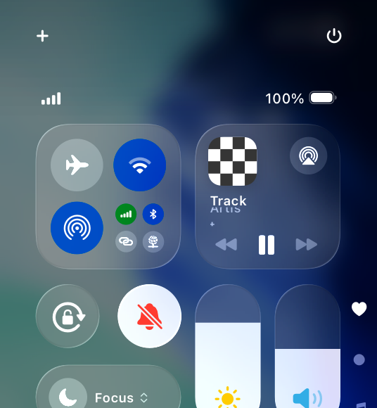 A partial screenshot of Control Center on iPhone, highlighting that the Silent mode control is active, with a symbol of a bell with a line drawn through it and red tint.