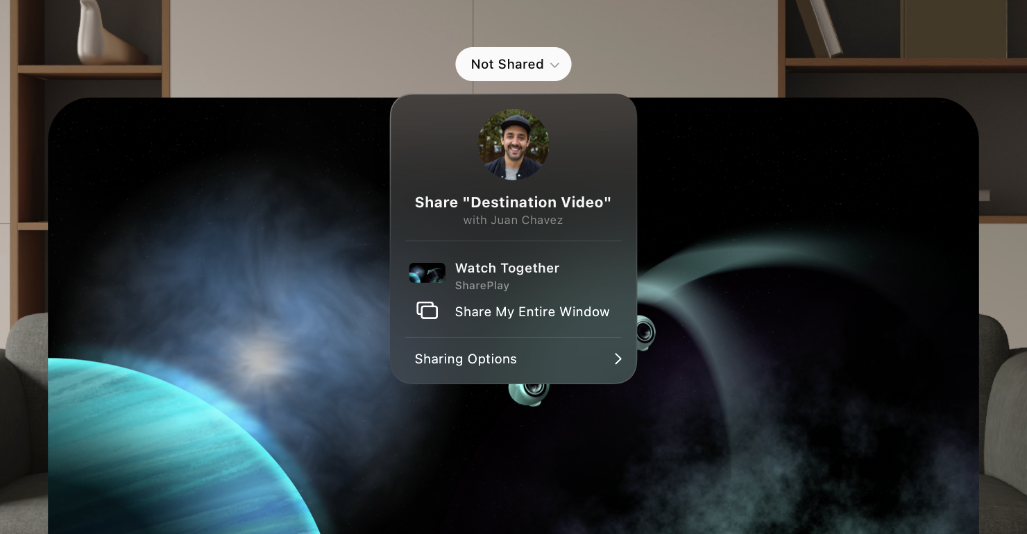 An image of a private TV window in visionOS, with the button above the window selected. A menu emerges downward from the button with options for sharing the window.
