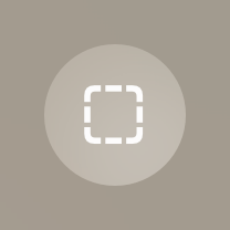 An image of a circular button that contains an icon of an outlined square with rounded corners. The button background is medium dark and the outline is white.