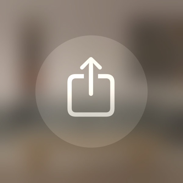 An illustration of a Share button with a translucent background material and a symbol. The symbol uses the secondary vibrant label color and has high contrast against the background material.