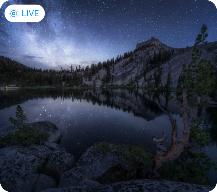 A nighttime photo of an alpine lake with a system-provided Live Photo badge with the text Live in the upper left corner.