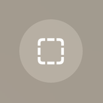 An image of a circular button that contains an icon of an outlined square with rounded corners. The button background is dark and the dashed outline is white.