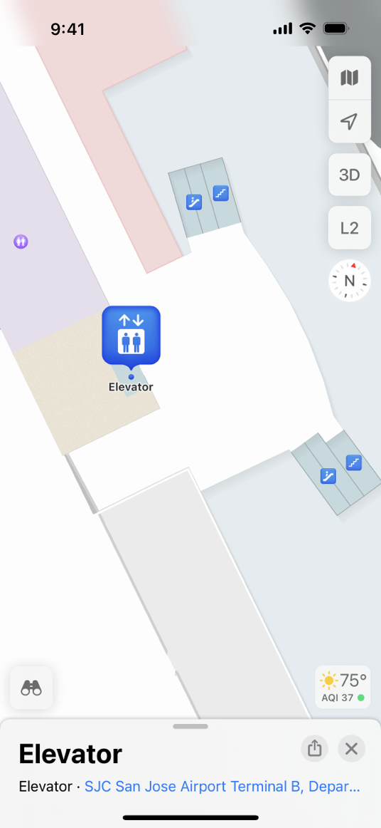 A screenshot of a map on iPhone, zoomed in to show the location of an elevator in San Jose International airport. A minimized card containing information about the elevator is visible at the bottom of the screen.
