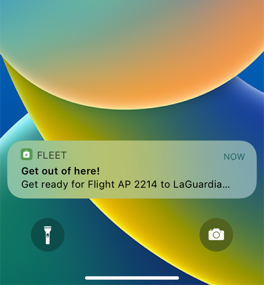 A screenshot of the Lock Screen on iPhone, showing a notification about an upcoming flight.