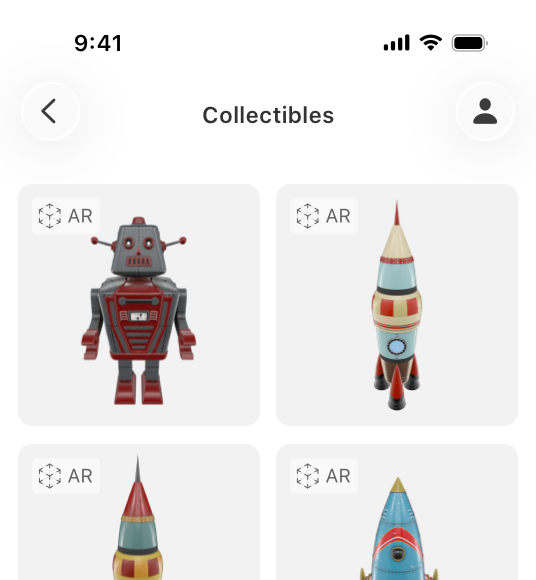 An illustration of a partial iPhone screen. On the screen is an app with four gray squares in a grid layout, each containing a picture of a vintage toy: one robot, and three rocket ships. In the upper left corner of each square is the AR badge with the glyph and the text AR.
