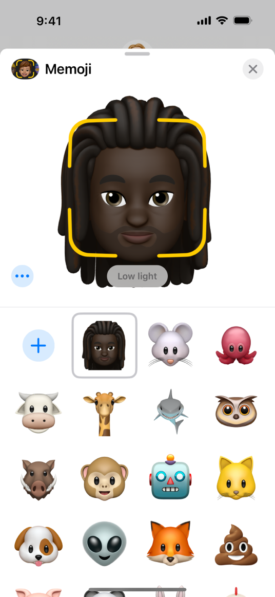 A screenshot of the Memoji recording sheet on iPhone. The app shows a person's Memoji, above a message that reads 'Low light', which helps convey that additional light is required for a high-quality recording.
